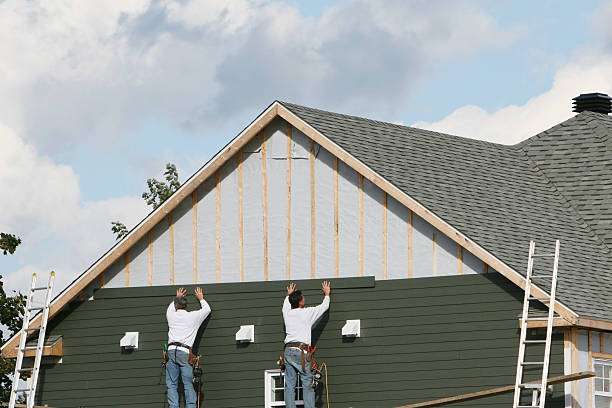Professional Siding technician working in Beach City, TX